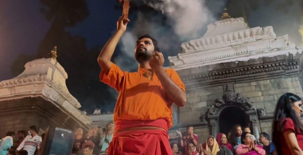 a-priest-during-pashupatinath-aarati-scaled
